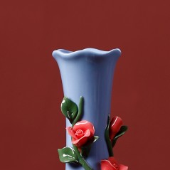 Blue handmade ceramic vase with rose