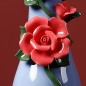 Blue handmade ceramic vase with rose