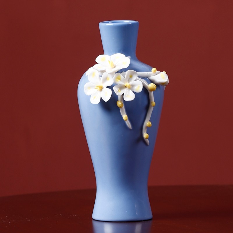 Blue handmade ceramic vase with flowers