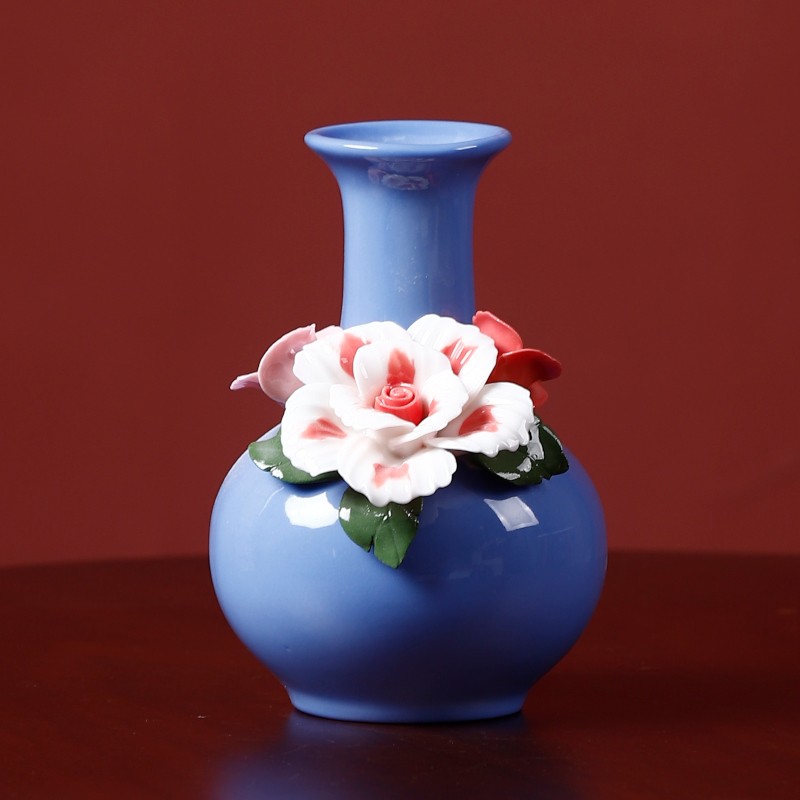 Blue handmade ceramic vase with flower