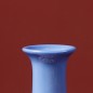 Blue handmade ceramic vase with flower