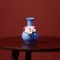 Blue handmade ceramic vase with flower