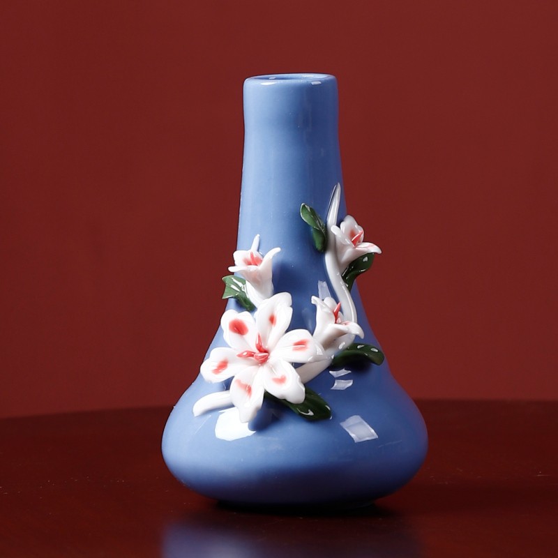 Blue handmade ceramic vase with flower