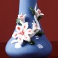 Blue handmade ceramic vase with flower