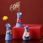 Blue handmade ceramic vase with flower