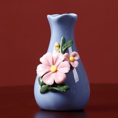 Blue handmade ceramic vase with flowers