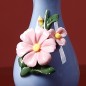 Blue handmade ceramic vase with flowers