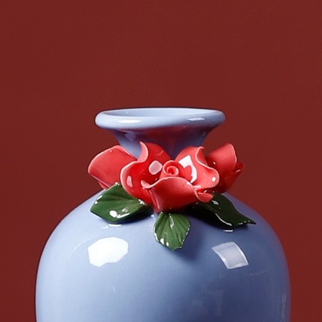 Blue handmade ceramic vase with rose