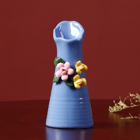 Blue handmade ceramic vase with flowers